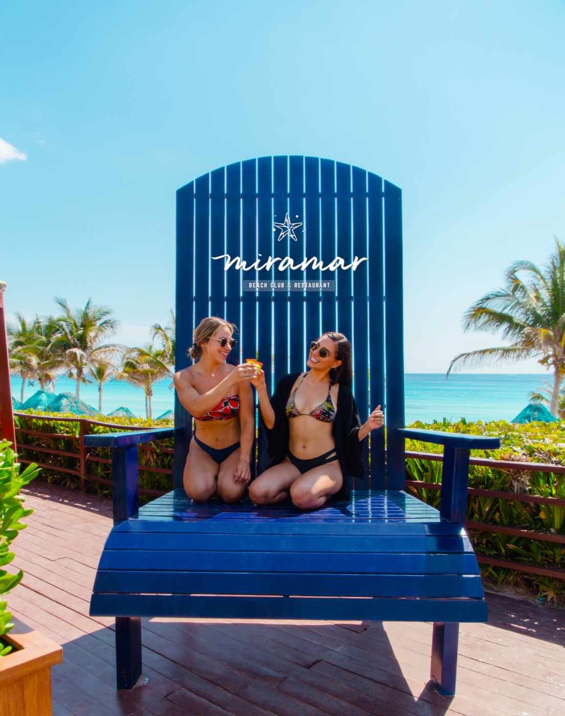 Guests doing activities with entertainers on the beach at Hotel Grand Oasis Cancun