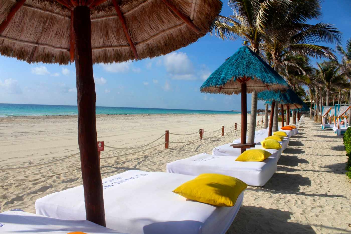 Beach in front of Grand Oasis Cancun Hotel with waves