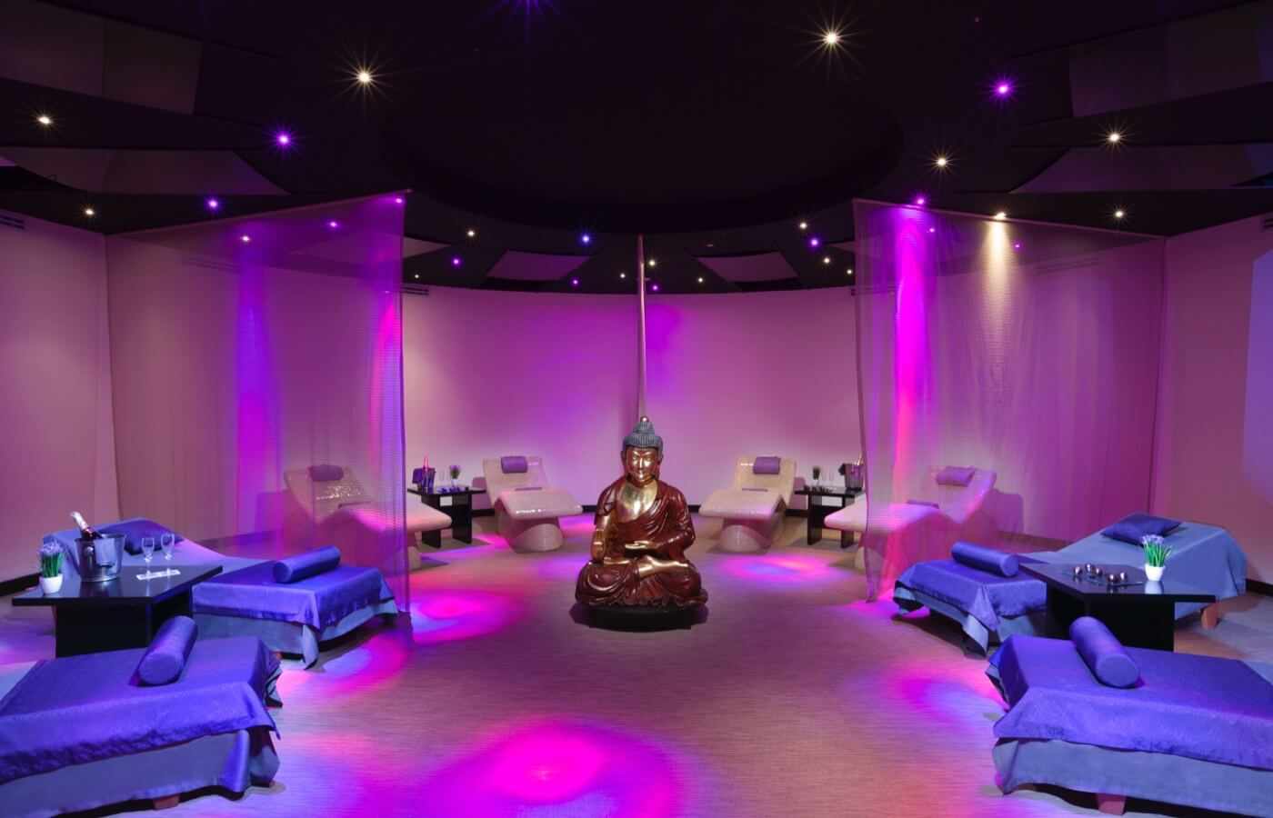 Spa area set with lights, curtains and a statue of a Buddha at The Pyramid at Grand Oasis Hotel