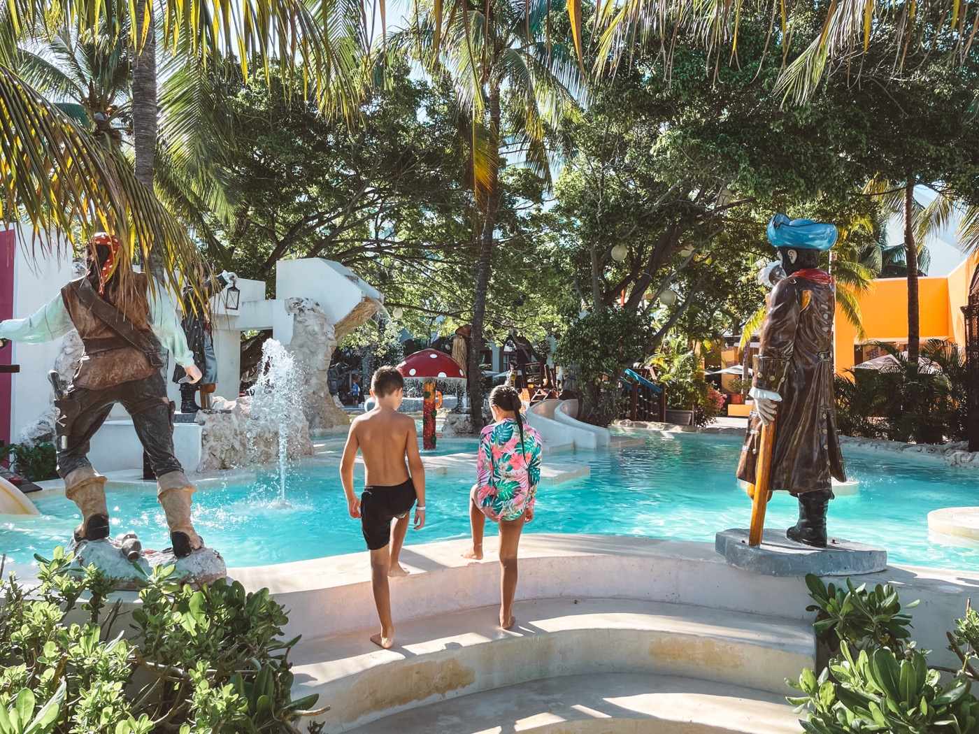 Playground at KiddoZone with consoles and puff armchairs at Hotel Grand Oasis Palm